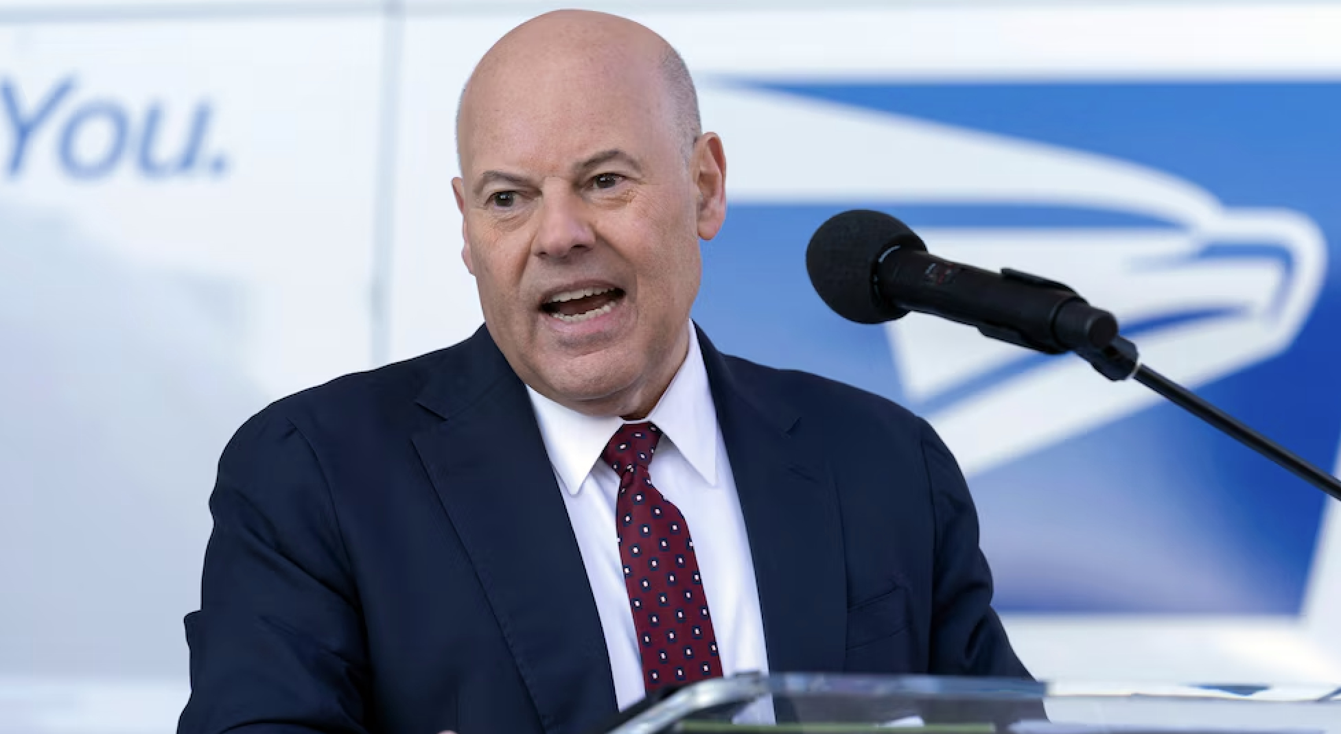 Louis DeJoy announced his resignation as the postmaster general of the USPS