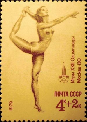 USSR: Moscow Olympic Games - beautiful female gymnast in a moment as she is making one of her gracious moves